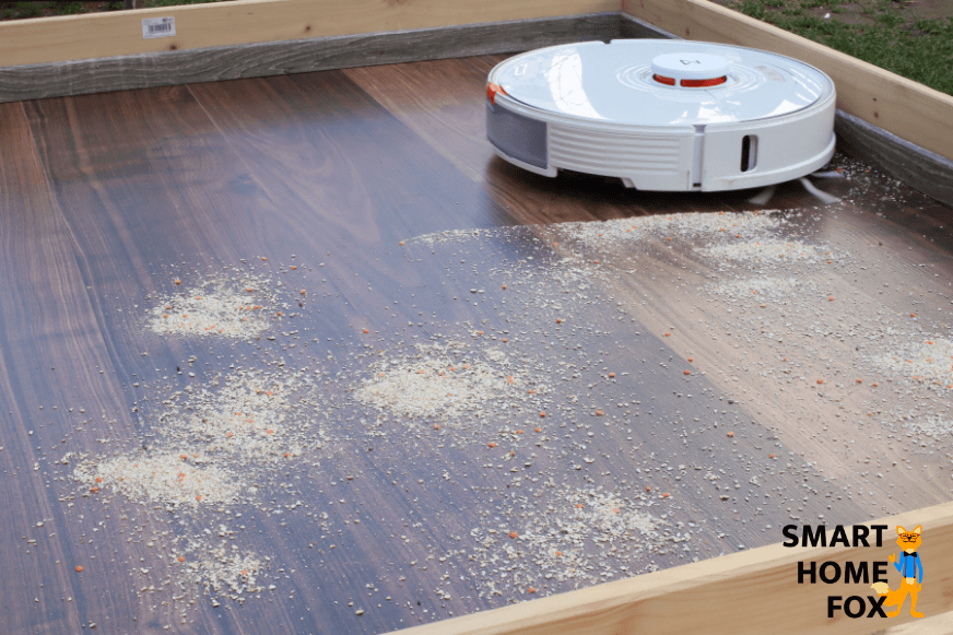 The Roborock S7 vacuums oat flakes on a hard floor